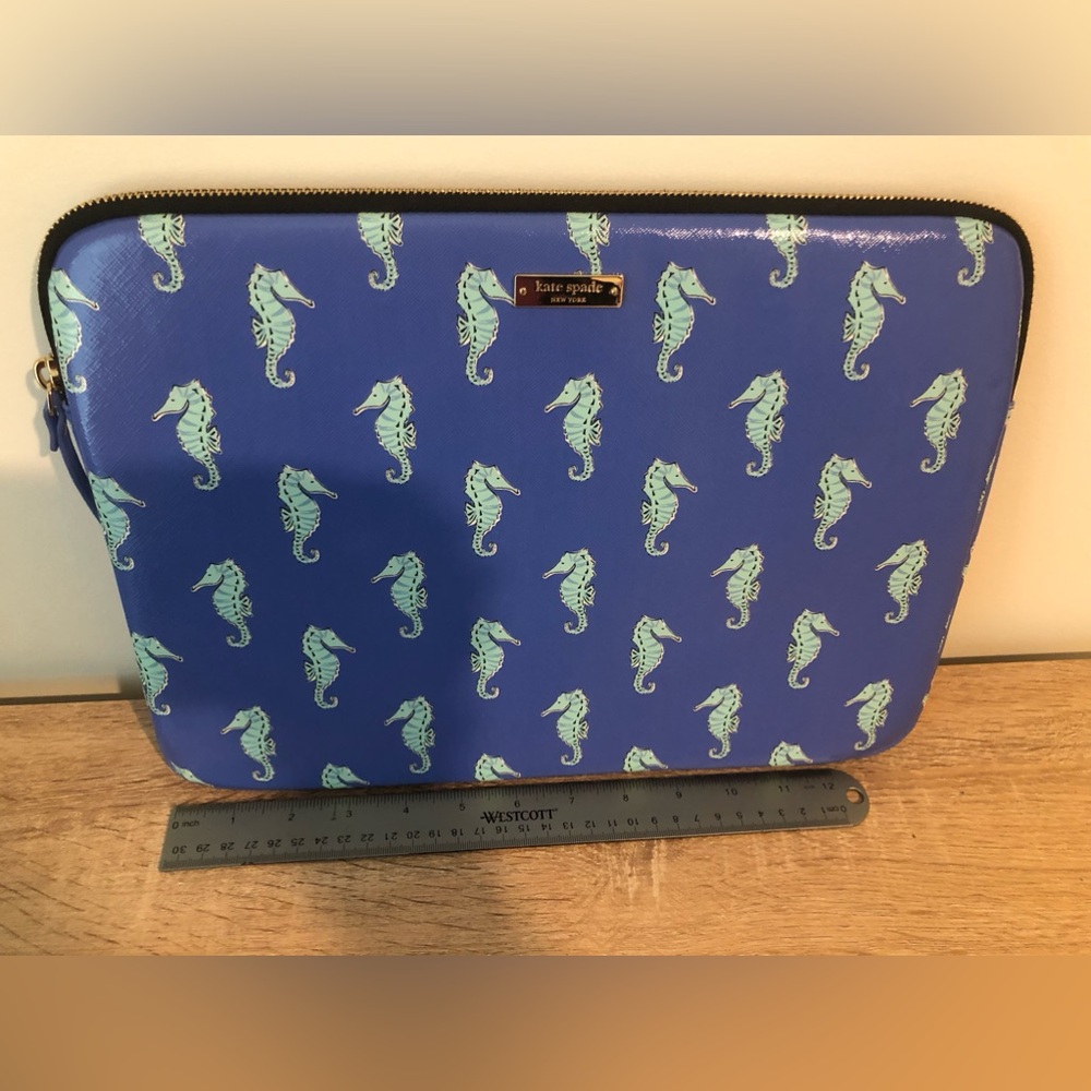 Brand new Kate Spade 13 1/2 inches wide by 9 3/4 inches iPad holder. Gorgeous